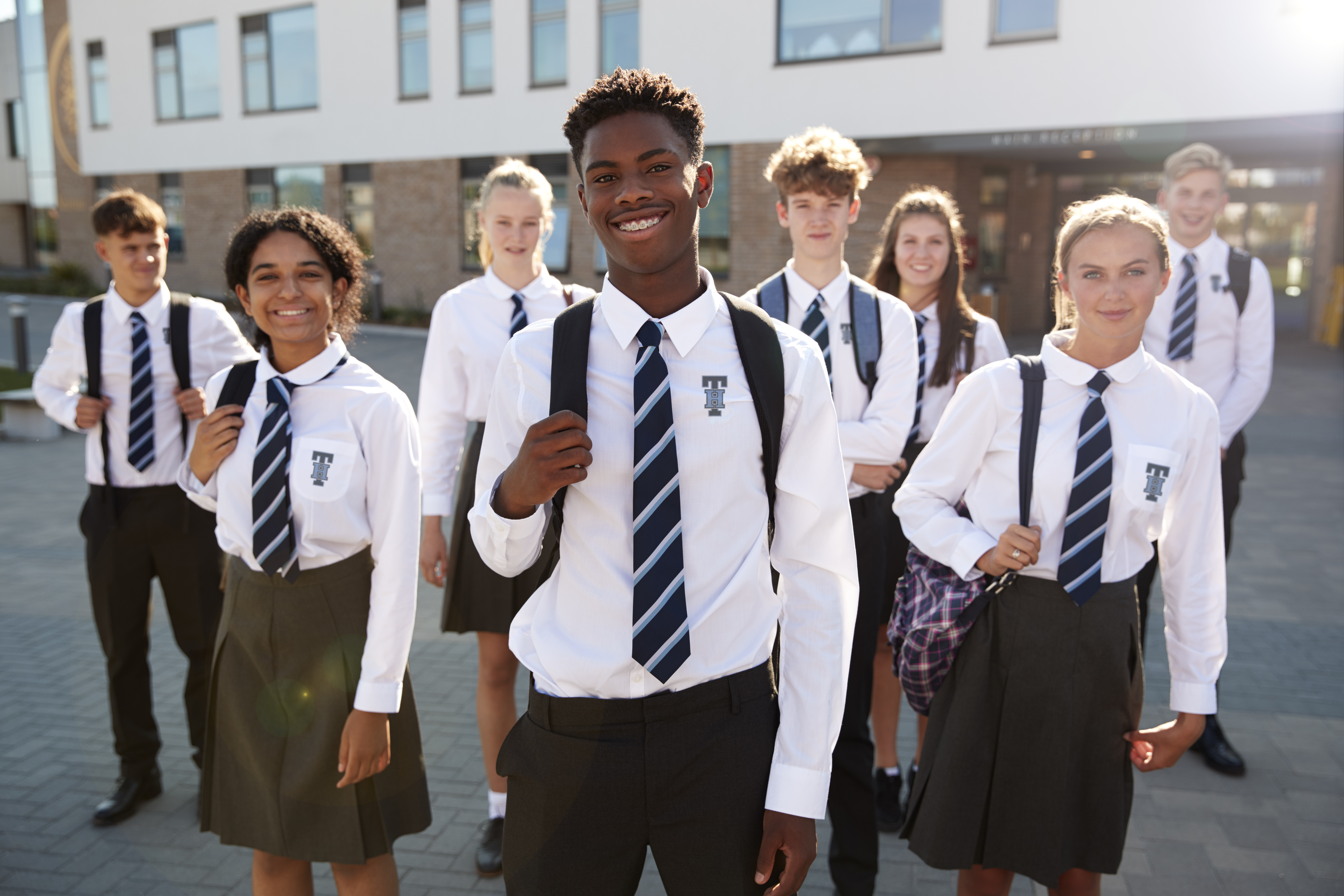 Schools Build Brand Awareness with SquadLocker | Students in School Dress Uniforms