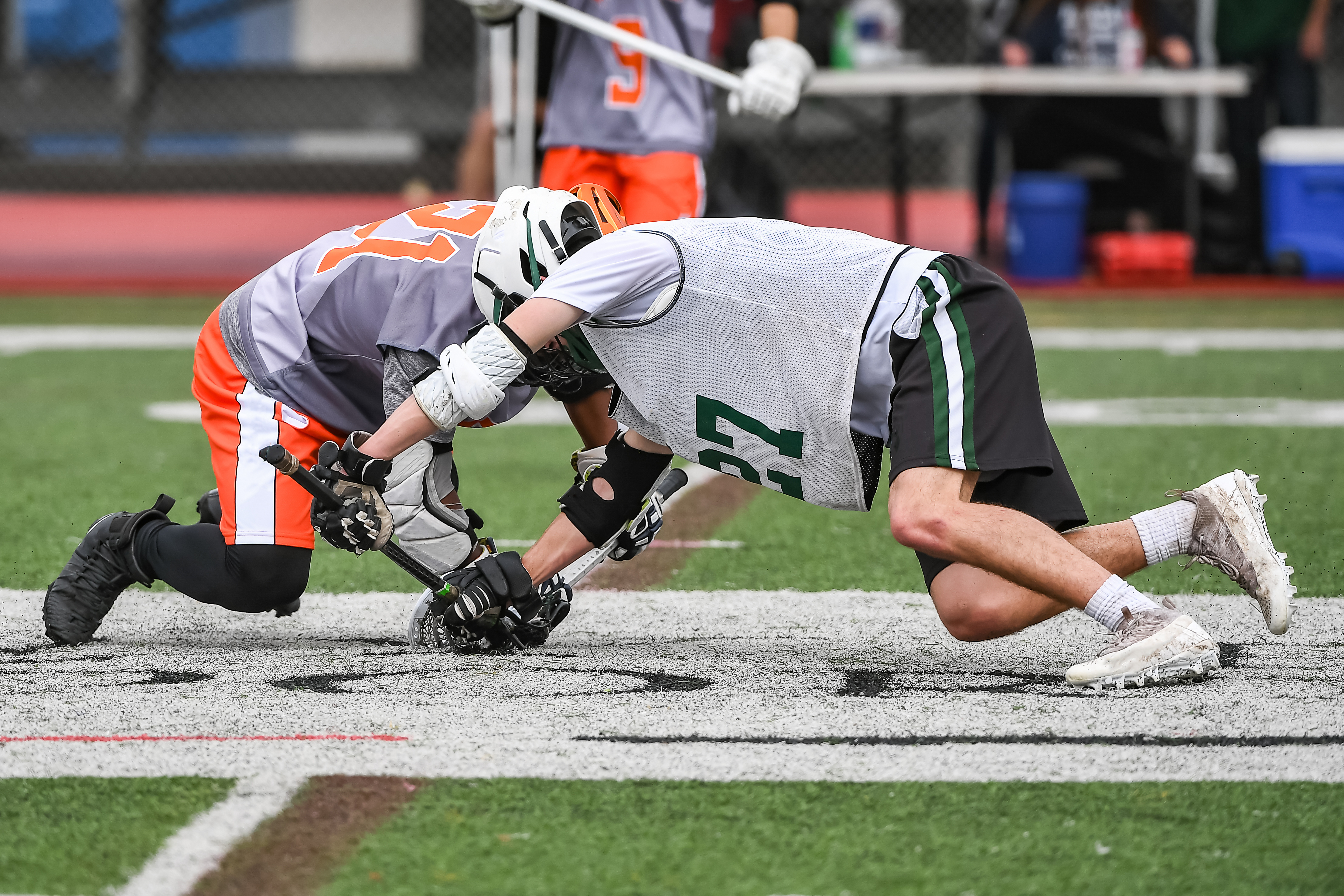 Lacrosse Face off players wearing custom lacrosse pinnies