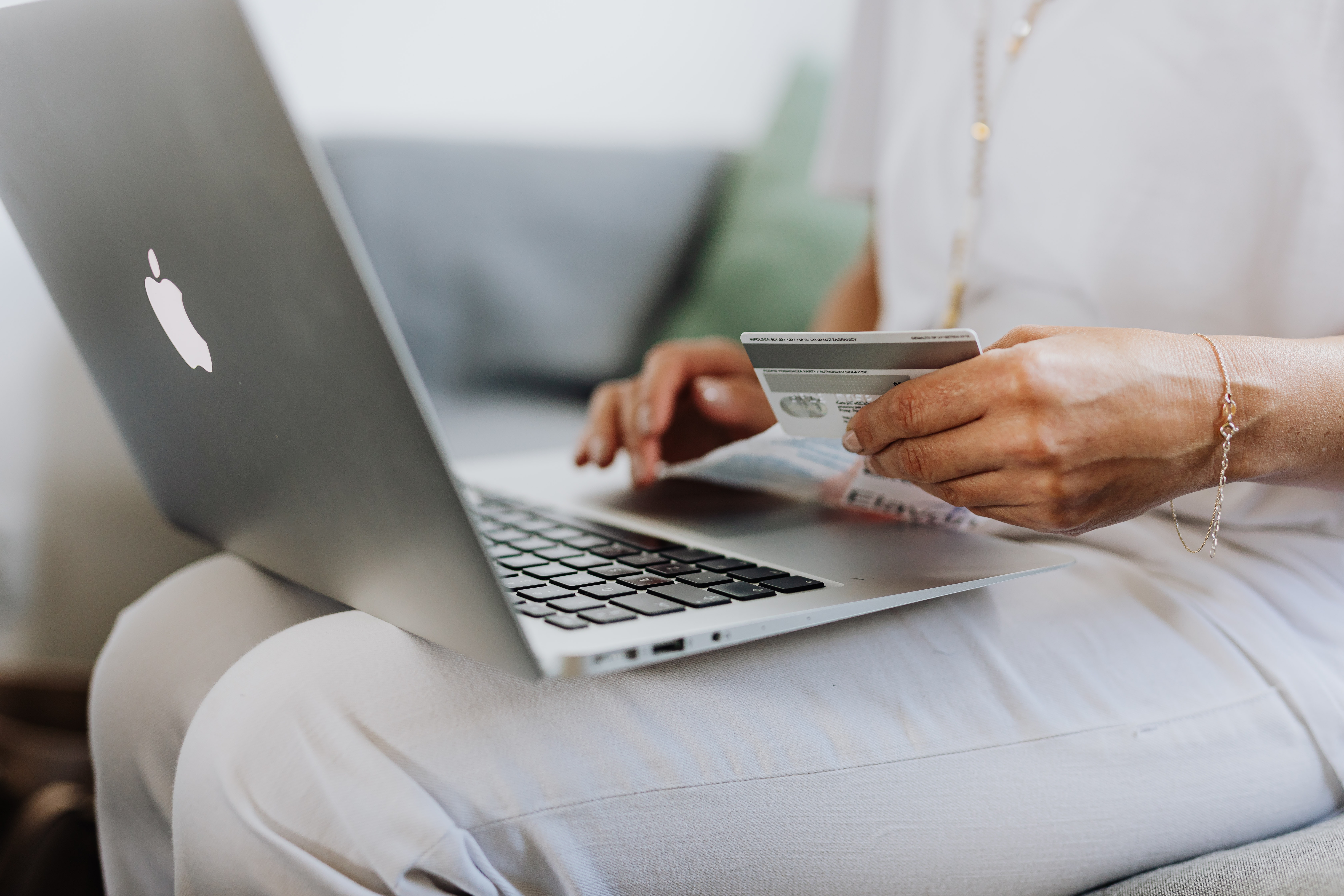 woman holding a credit card online shopping 