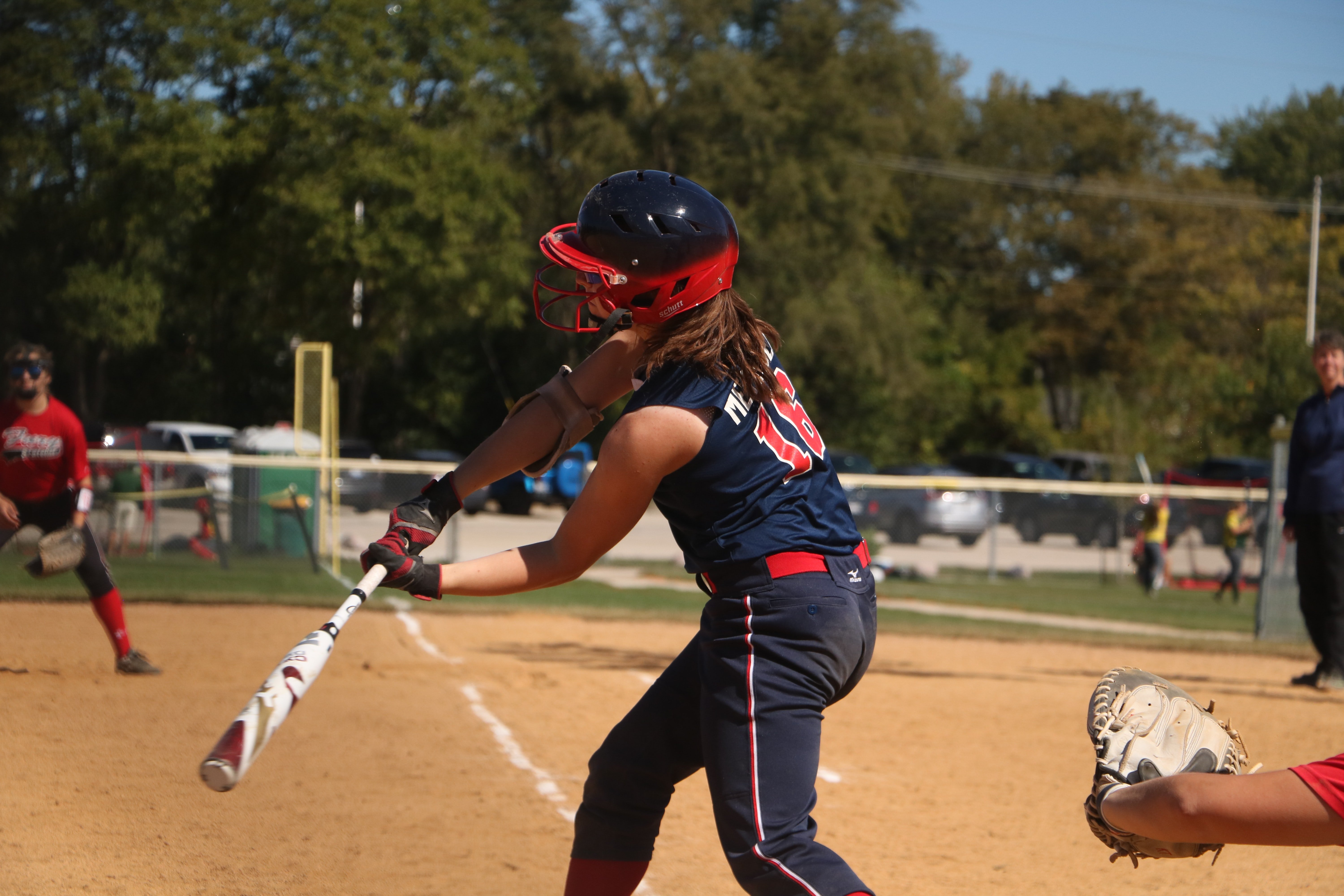 young woman playing softball