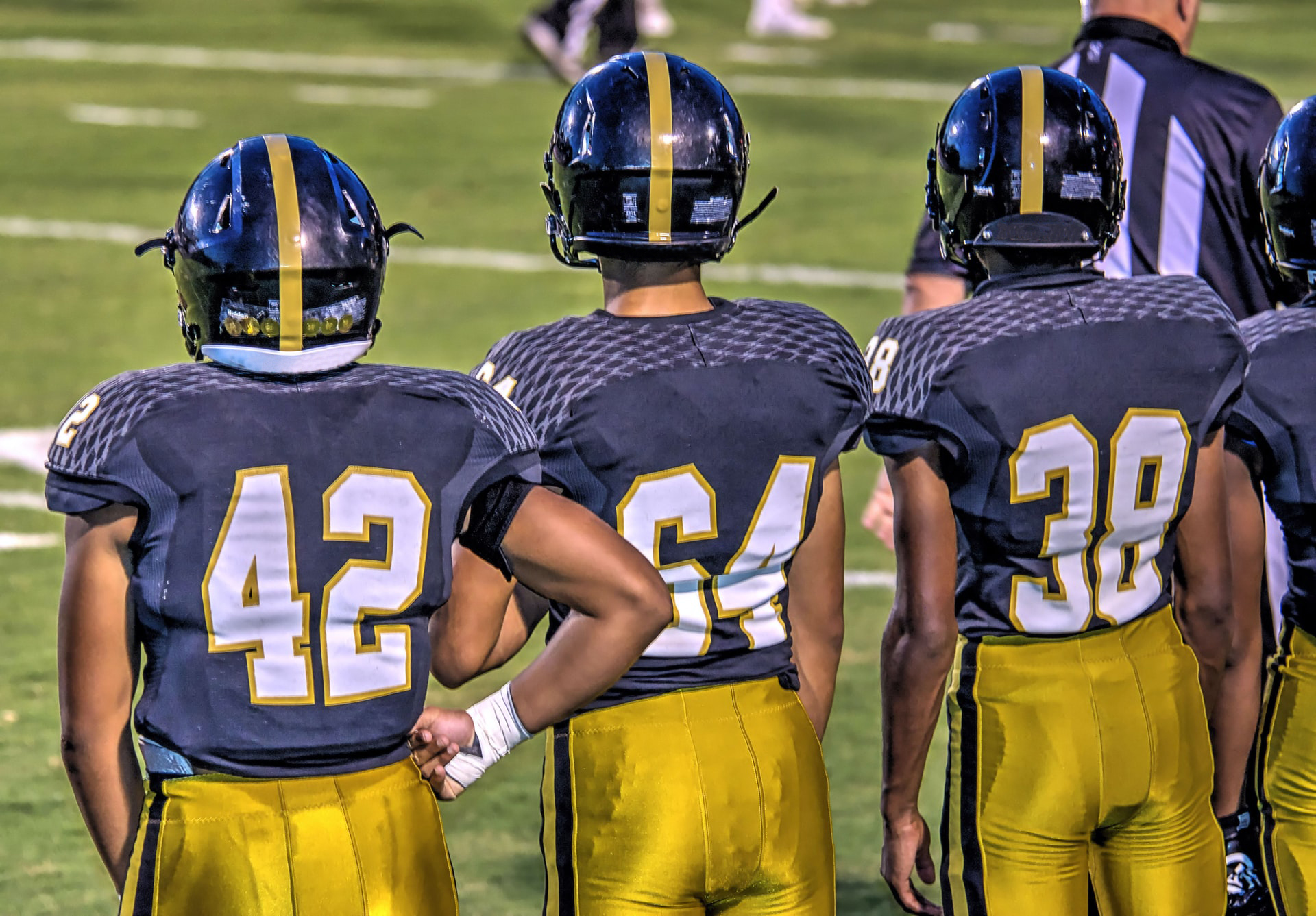 youth football players on the sideline